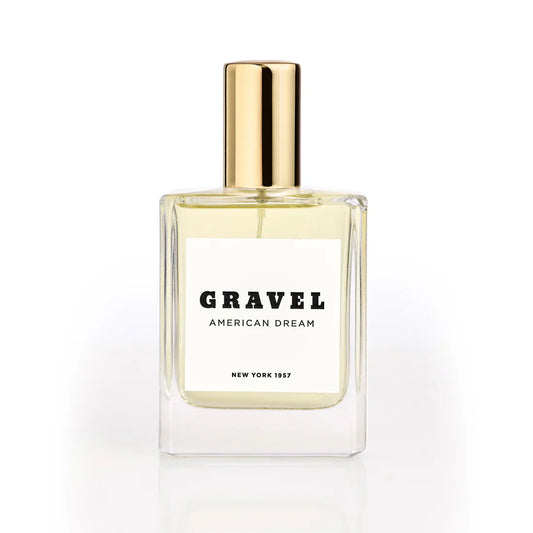 American Dream by GRAVEL niche perfume bottle with golden cap on white background