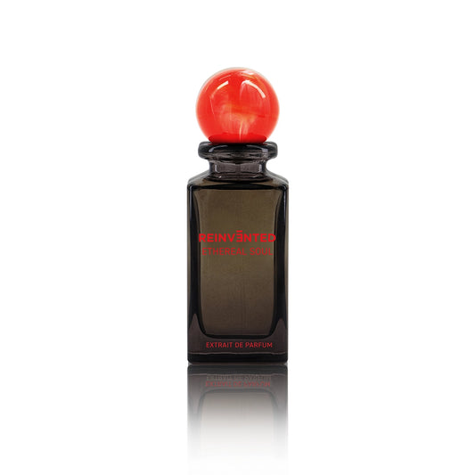 Ethereal Soul by Reinvented Extrait de Parfum bottle with red marble cap on white background