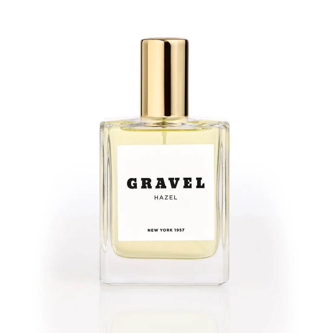 Hazel by GRAVEL niche perfume bottle with golden cap on white background