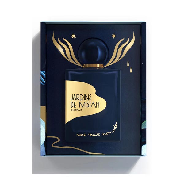 Une Nuit Nomade Jardins de Misfah Extrait luxury perfume presentation box with deep navy bottle and golden artistic packaging, niche fragrance inspired by Arabian date gardens, warm spices, and rich oriental gourmand notes