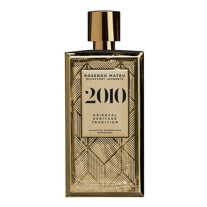 Rosendo Mateu 2010 Olfactory Journeys perfume bottle with gold geometric glass design and metallic cap.