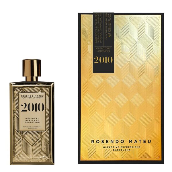 Rosendo Mateu 2010 Olfactory Journeys perfume bottle with gold geometric glass design beside matching gold presentation box.