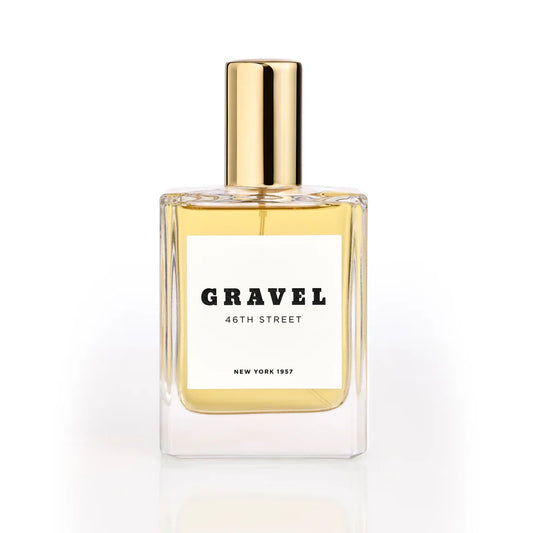 46th Street by GRAVEL niche perfume bottle with golden cap on white background
