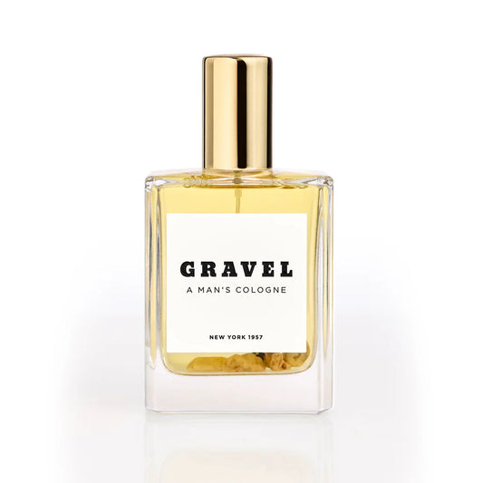 A Man’s Cologne by GRAVEL niche perfume bottle with golden cap on white background