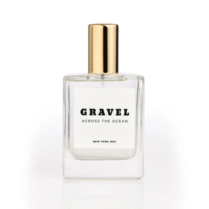 Across the Ocean by GRAVEL luxury perfume bottle with golden cap on white background
