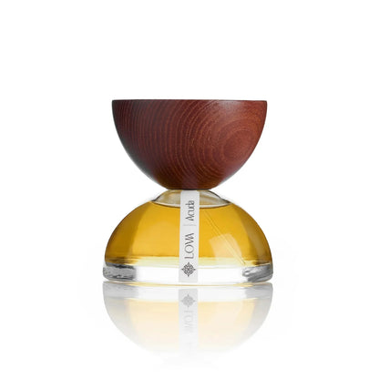 Acuada by LOVA niche perfume bottle with golden glass base and handcrafted wooden cap on white background