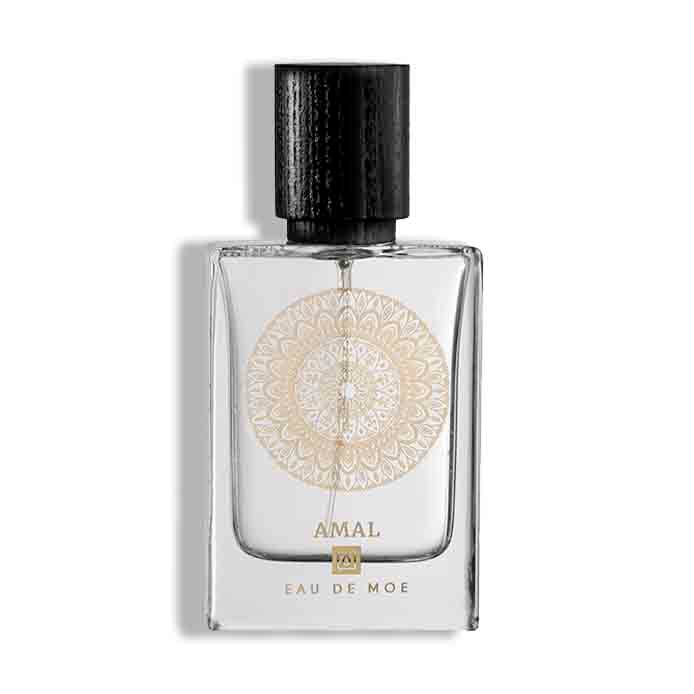 Amal Eau De Moe perfume bottle with clear glass design, gold circular mandala print, and black textured cap