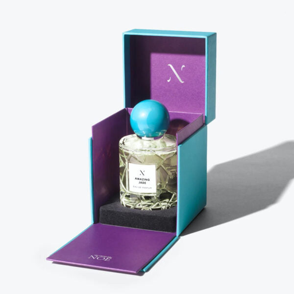 Amazing Jade Eau de Parfum by Les Sœurs de Noé luxury perfume bottle with turquoise cap displayed in open teal and purple gift box