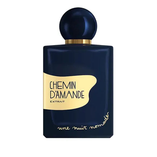 Une Nuit Nomade Chemin d’Amande Extrait perfume in deep navy bottle with gold label and spherical cap, luxurious niche fragrance inspired by creamy almond, warm gourmand sweetness, and elegant oriental character