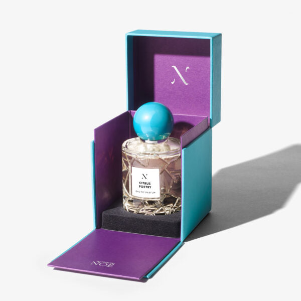 Citrus Poetry Eau de Parfum by Les Sœurs de Noé luxury perfume bottle in turquoise and purple gift box packaging