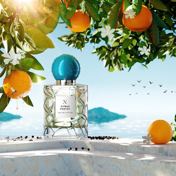 Citrus Poetry Eau de Parfum by Les Sœurs de Noé luxury perfume bottle with fresh oranges on Mediterranean seaside background