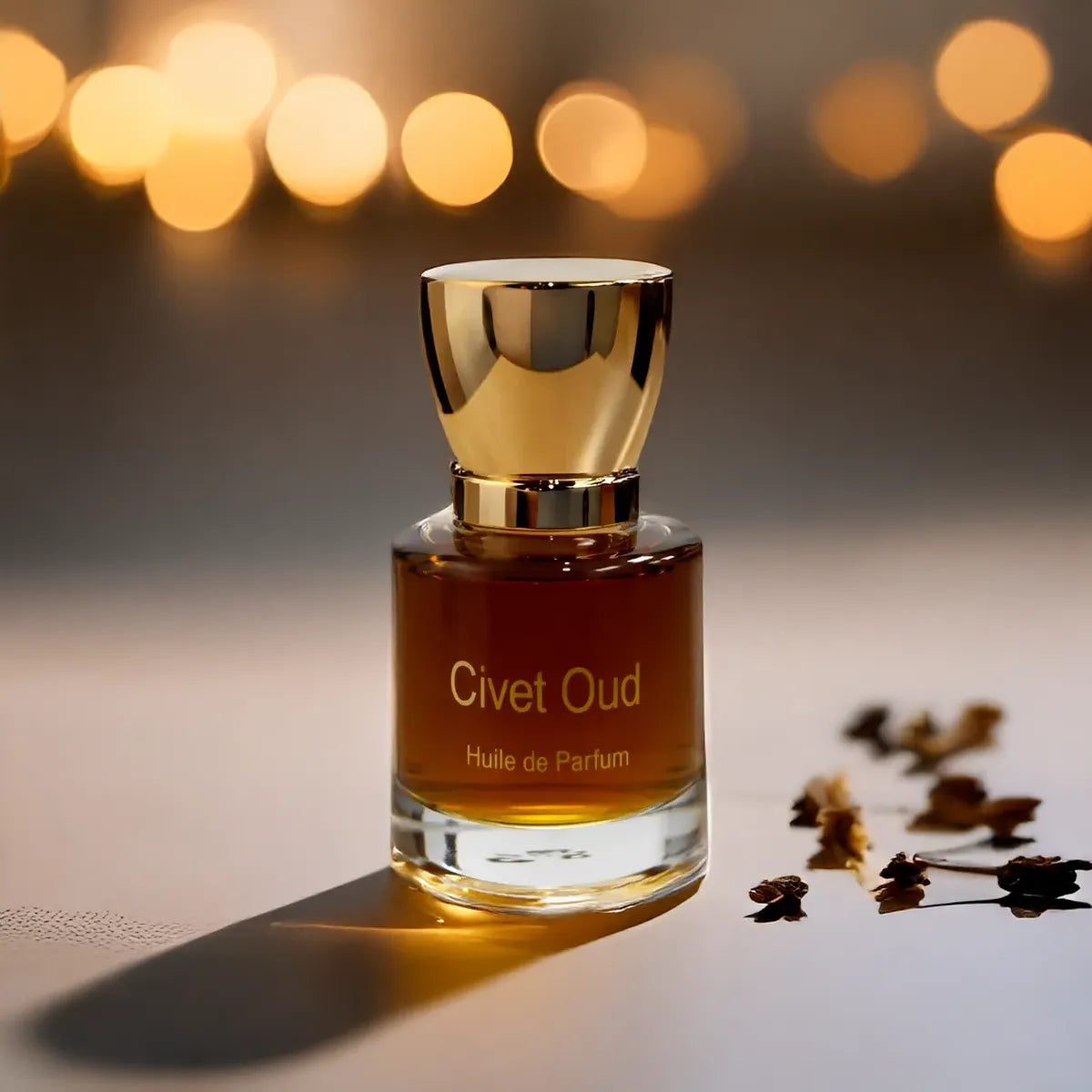Civet Oud perfume bottle with glowing bokeh lights and delicate dried florals on a minimal surface