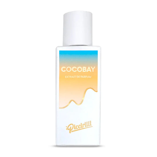 Cocobay Extrait de Parfum by iPiccirilli fragrance bottle with white cap and gradient sunset label design