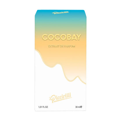 Cocobay Extrait de Parfum 30ml by iPiccirilli fragrance box with tropical gradient blue and gold packaging design