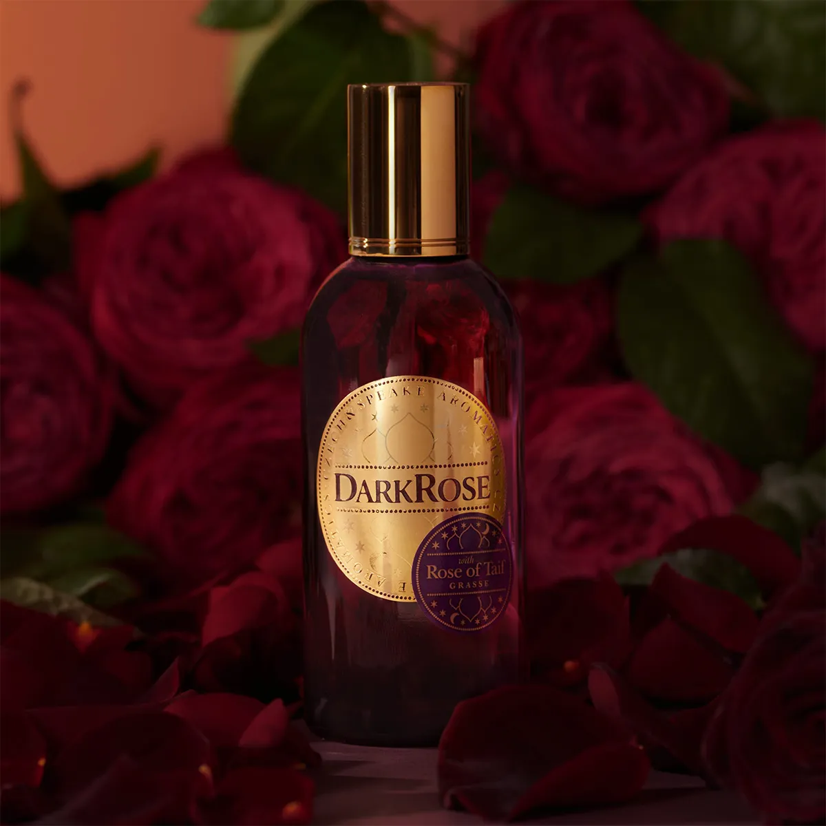 Czech & Speake Dark Rose perfume bottle surrounded by deep red roses, luxurious rose fragrance featuring Rose of Taif from Grasse, elegant niche perfume from London