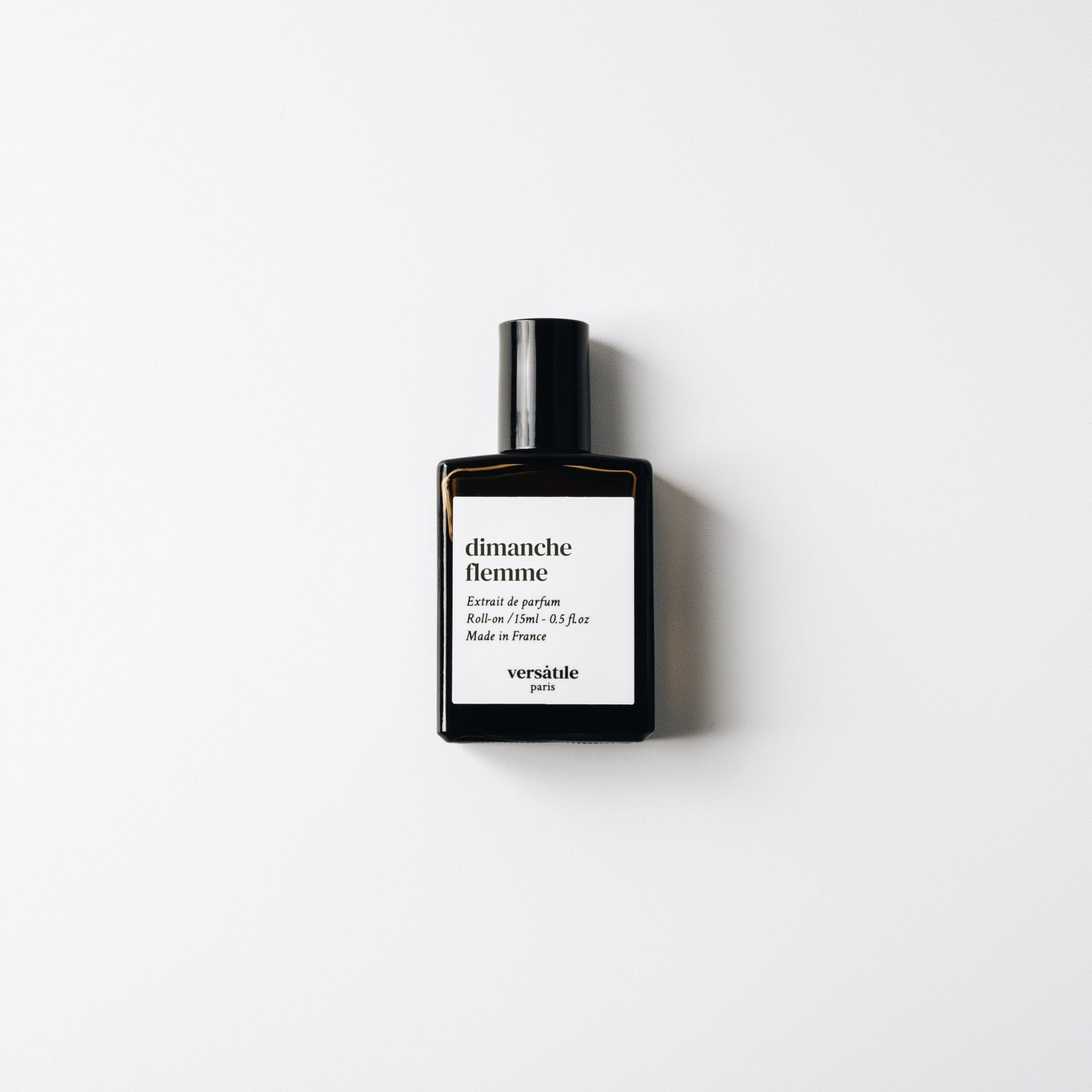 Versatile Paris Dimanche Flemme extrait de parfum bottle on white background