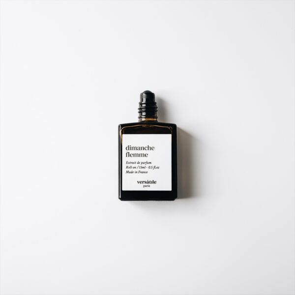 Versatile Paris Dimanche Flemme roll-on perfume bottle with cap removed on white background