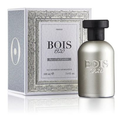 Bois 1920 Dolce Di Giorno perfume bottle with metallic silver finish and black cap displayed beside its elegant fragrance box.
