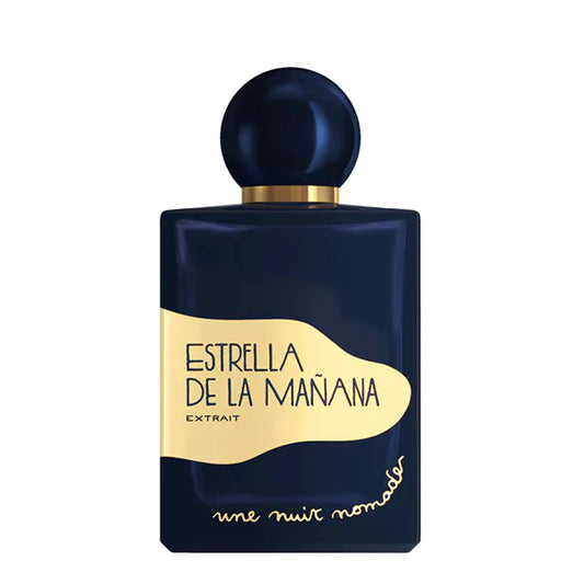 Une Nuit Nomade Estrella de la Mañana Extrait perfume in deep navy bottle with gold label and spherical cap, luxurious niche fragrance inspired by radiant florals, warm spices, and elegant oriental sweetness