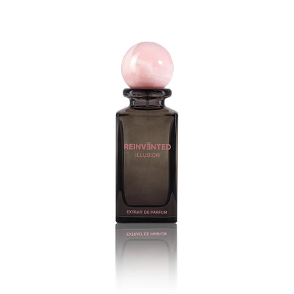 Reinvented Illusion Extrait de Parfum bottle with soft pink marble cap luxury niche fragrance