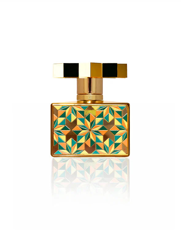 Kajal Kolada Extrait de Parfum gold bottle back design with intricate green geometric pattern and luxury finish