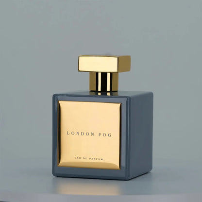London Fog Eau de Parfum by House of Brandt blue square perfume bottle with gold cap and metallic gold plaque on minimalist background luxury fragrance image