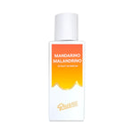 Perfume bottle with orange and white label on a white background
