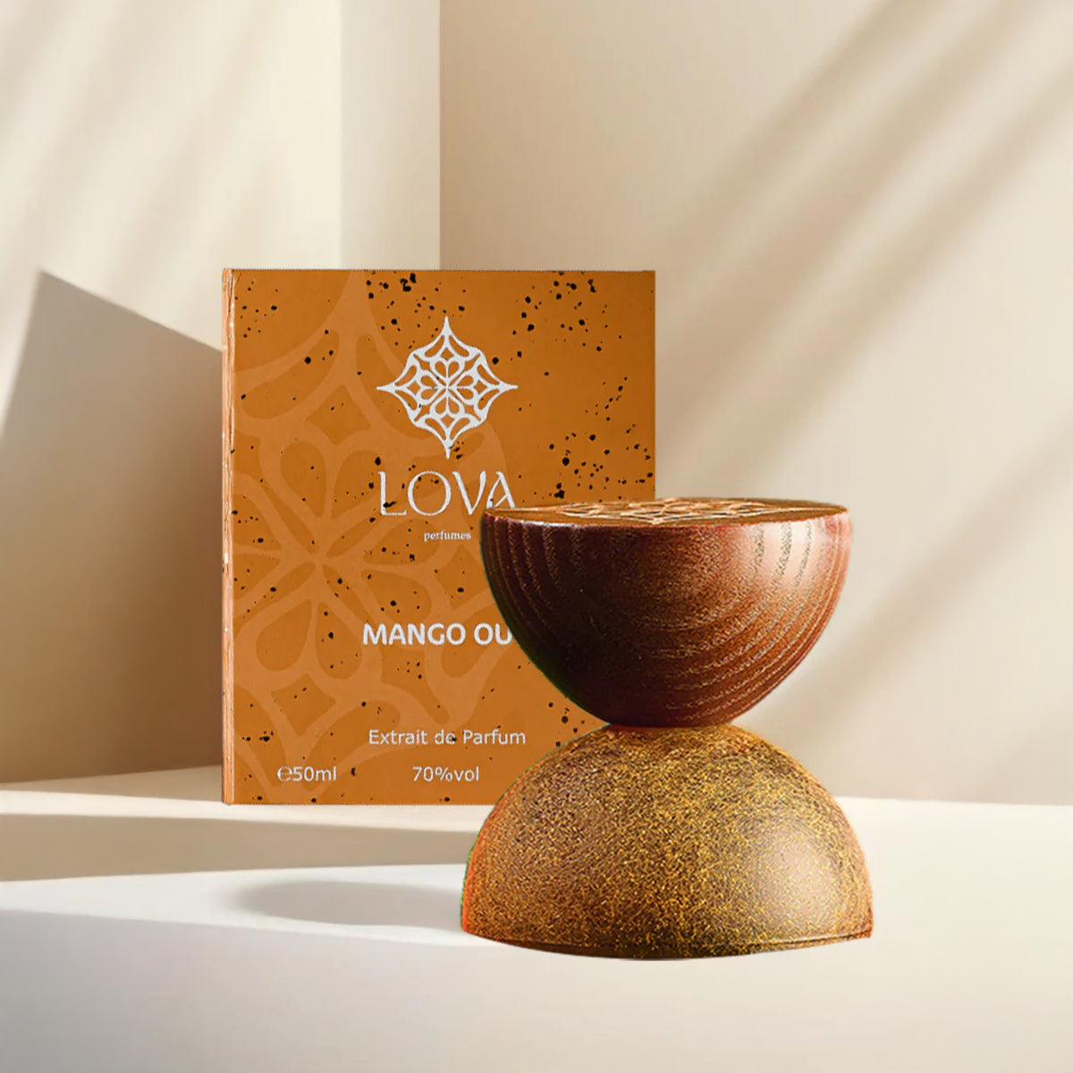 Mango Oud by LOVA Extrait de Parfum 50ml with textured golden bottle and branded orange box in luxury setting
