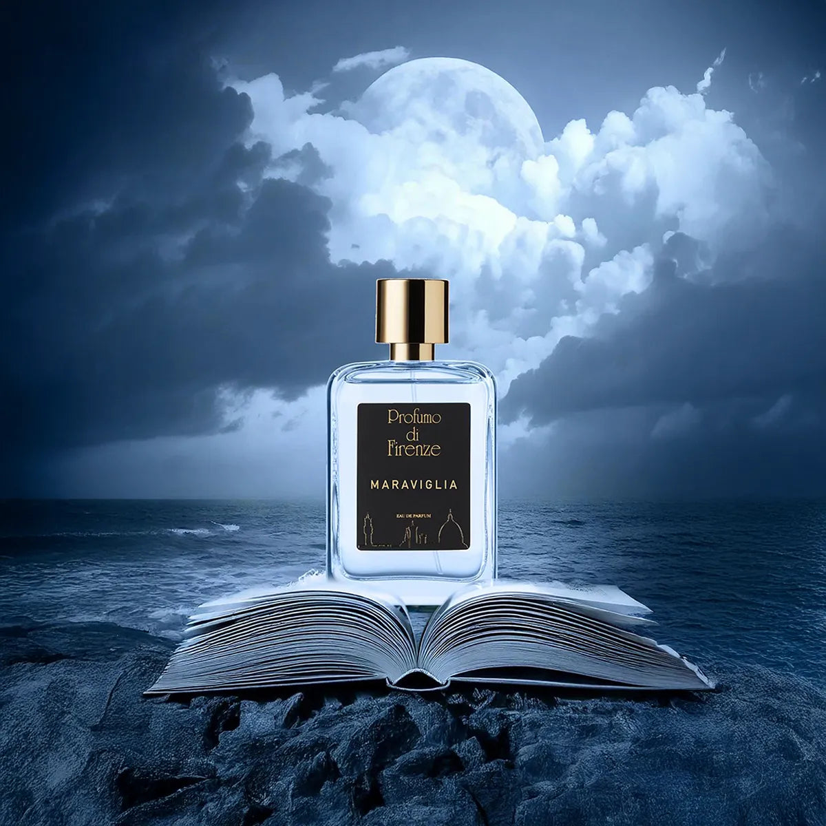 Perfume bottle labeled 'Maraviglia' on an open book with a moonlit sky background