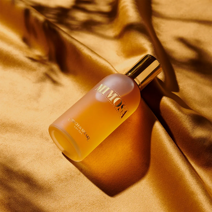 Czech & Speake Mimosa perfume bottle on golden silk fabric, elegant London fragrance with warm floral mimosa scent and luxurious gold cap