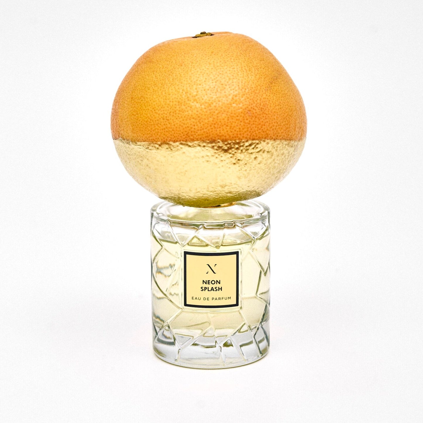 Neon Splash Eau de Parfum by Les Sœurs de Noé luxury perfume bottle with citrus-inspired gold cap isolated on white background
