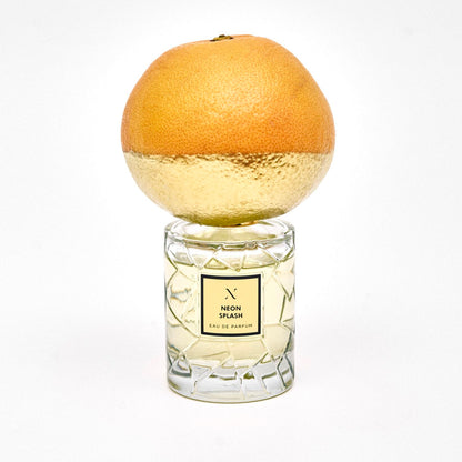 Neon Splash Eau de Parfum by Les Sœurs de Noé luxury perfume bottle with citrus-inspired gold cap isolated on white background