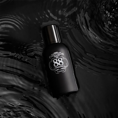 Czech & Speake No. 88 London fragrance bottle on dark liquid surface, luxury classic British cologne with elegant black design and aromatic heritage scent