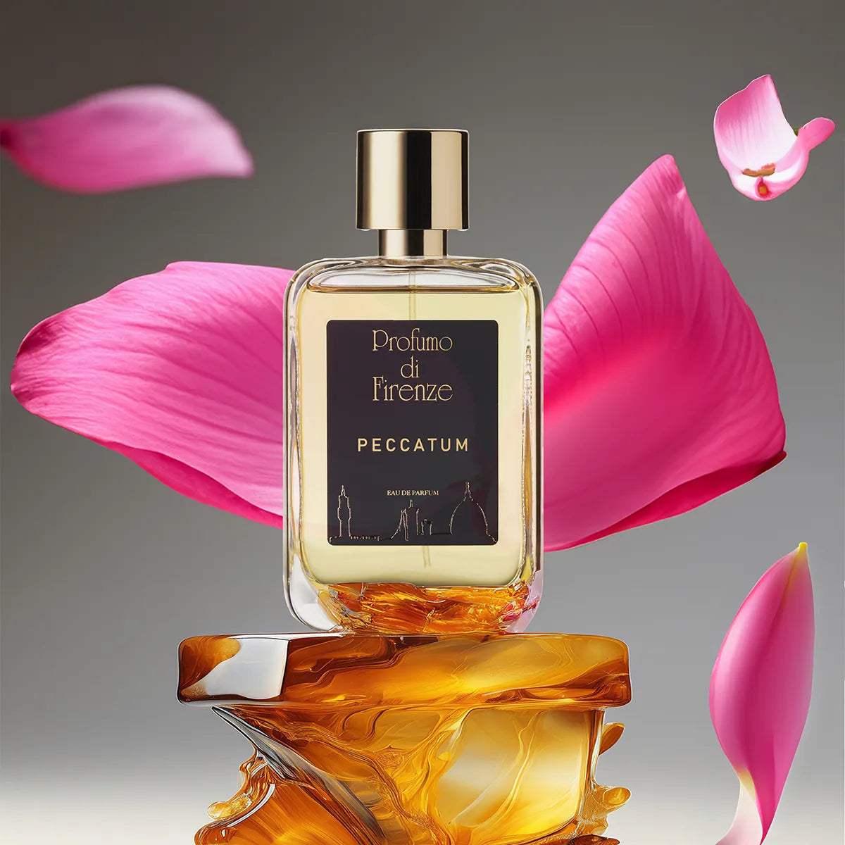 Perfume bottle labeled 'Peccatum' by 'Profumo di Firenze' with pink petals on a reflective surface.
