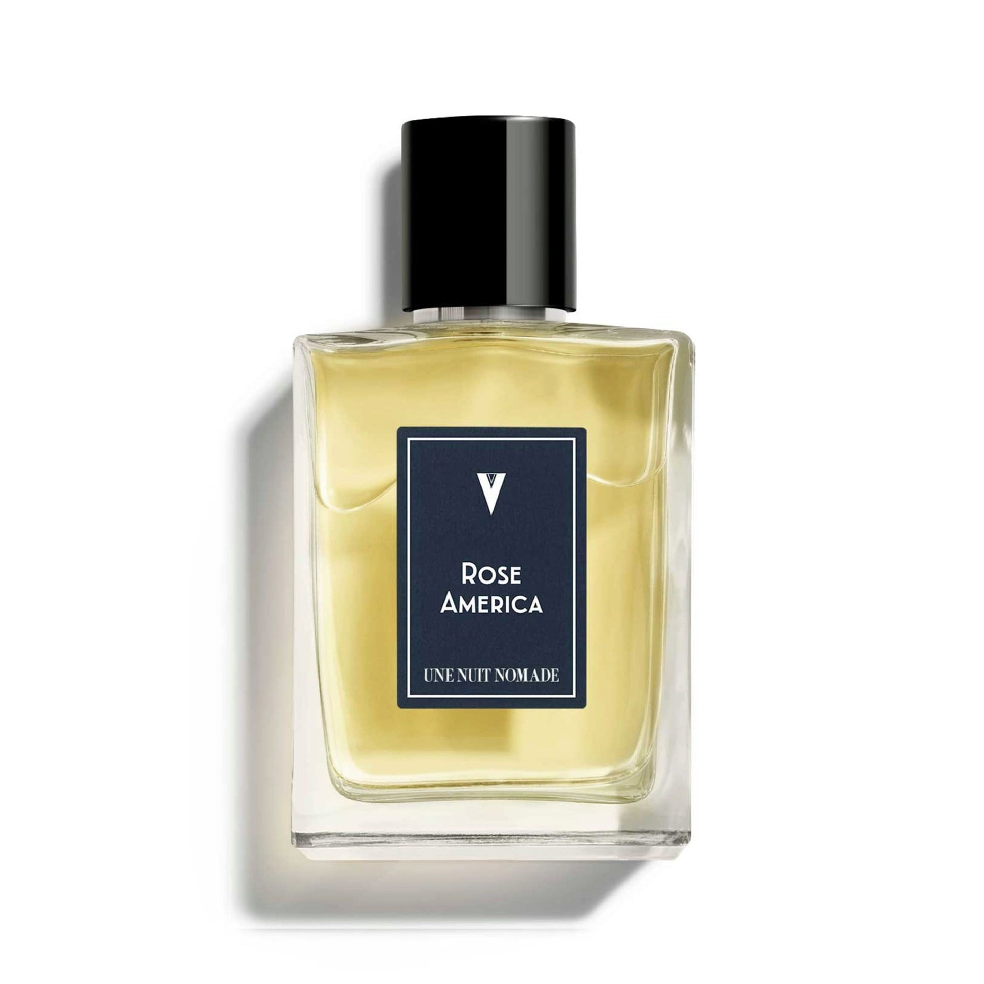 Une Nuit Nomade Rose America Eau de Parfum in clear glass bottle with black cap, niche fragrance inspired by fresh roses, soft florals, and elegant modern floral composition