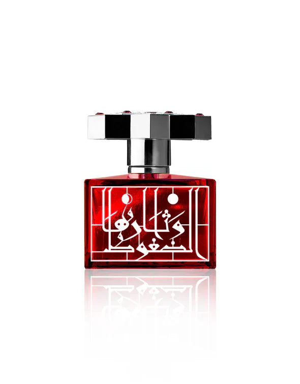 Ruby by Kajal Eau de Parfum red crystal perfume bottle with silver cap and Arabic calligraphy design