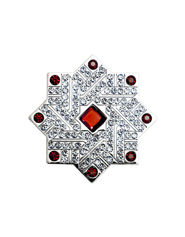Ruby by Kajal perfume cap close-up with silver star design, red gemstone center and crystal embellishments