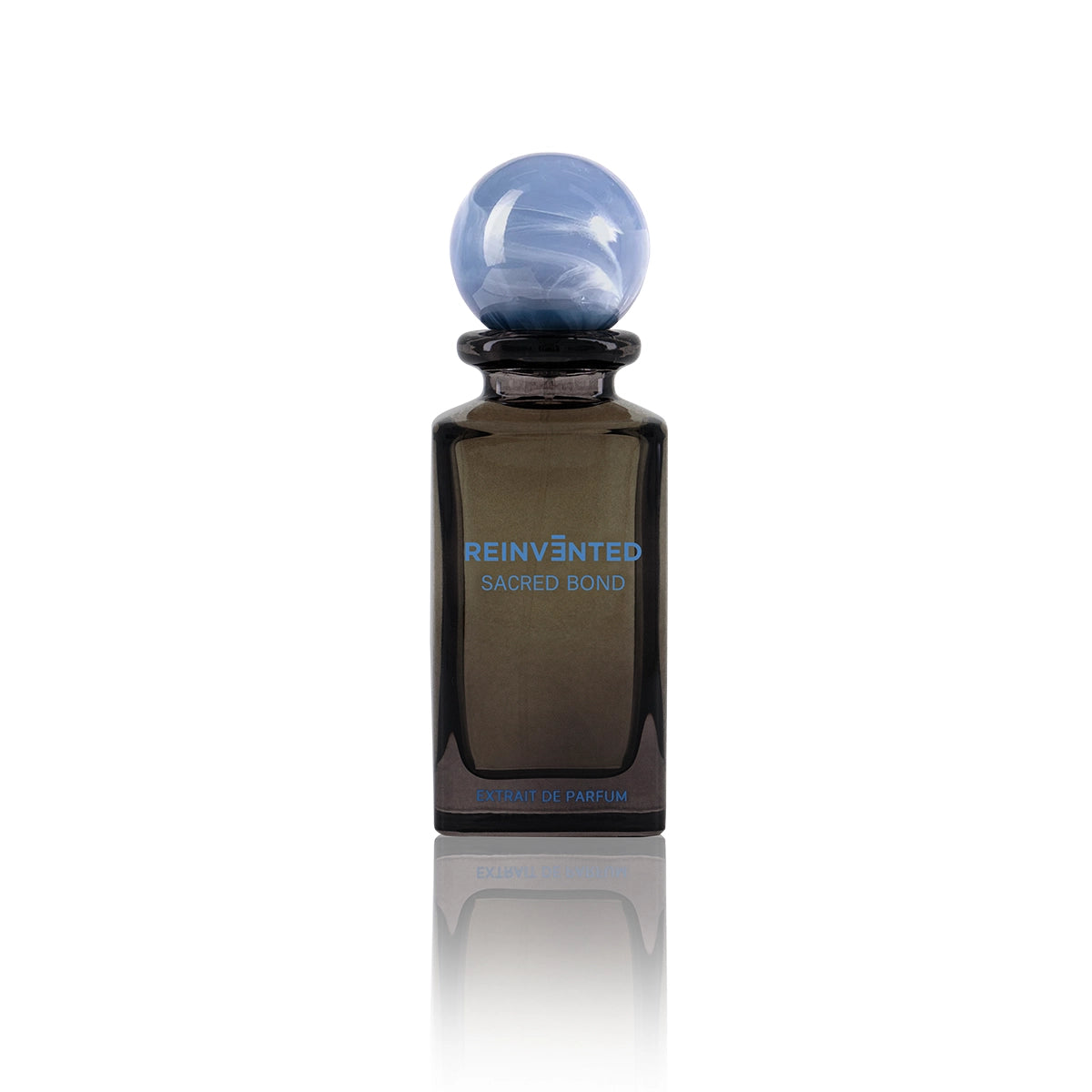 Reinvented Sacred Bond Extrait de Parfum bottle with blue marble cap luxury niche fragrance
