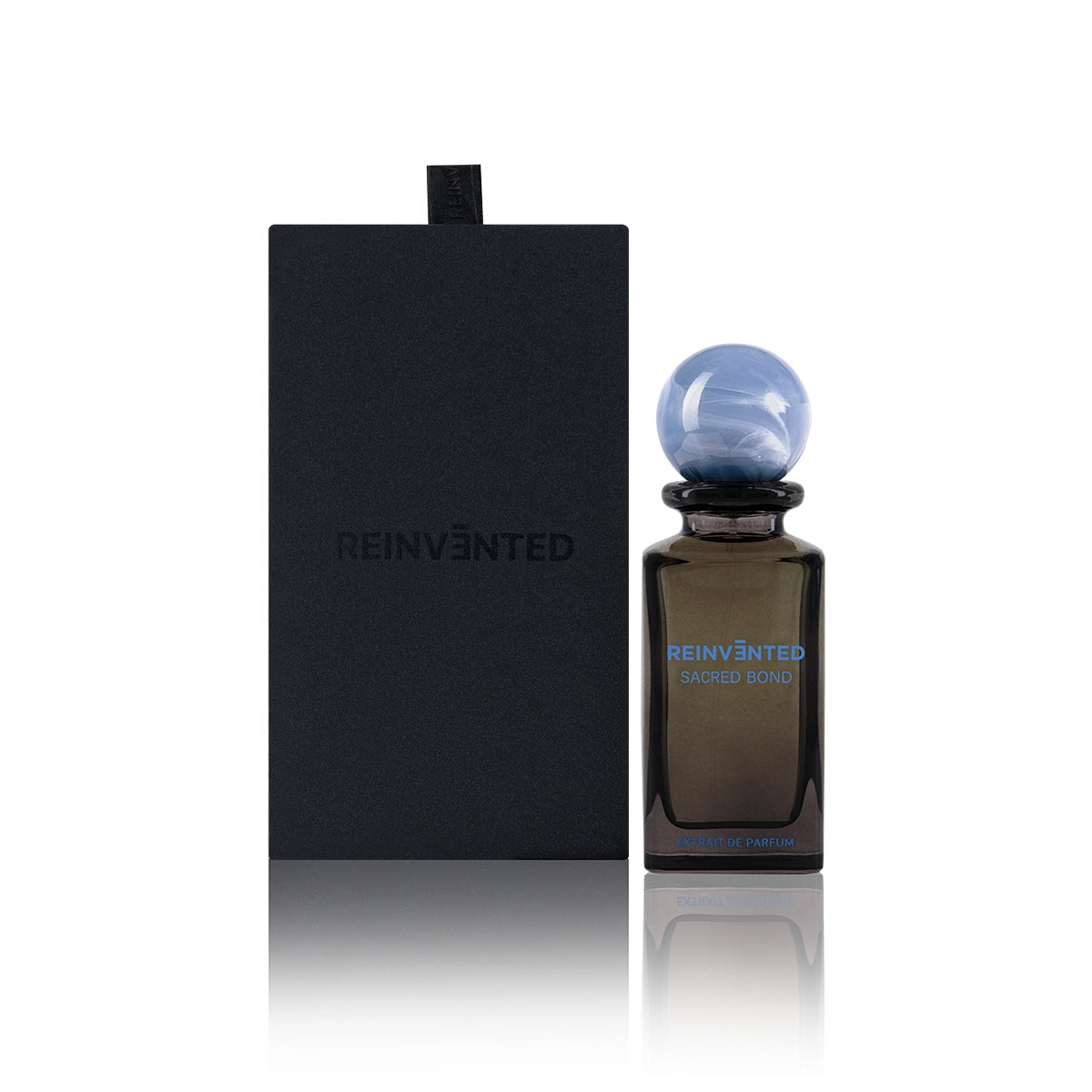 Reinvented Sacred Bond Extrait de Parfum with blue marble cap and black luxury box niche fragrance gift set