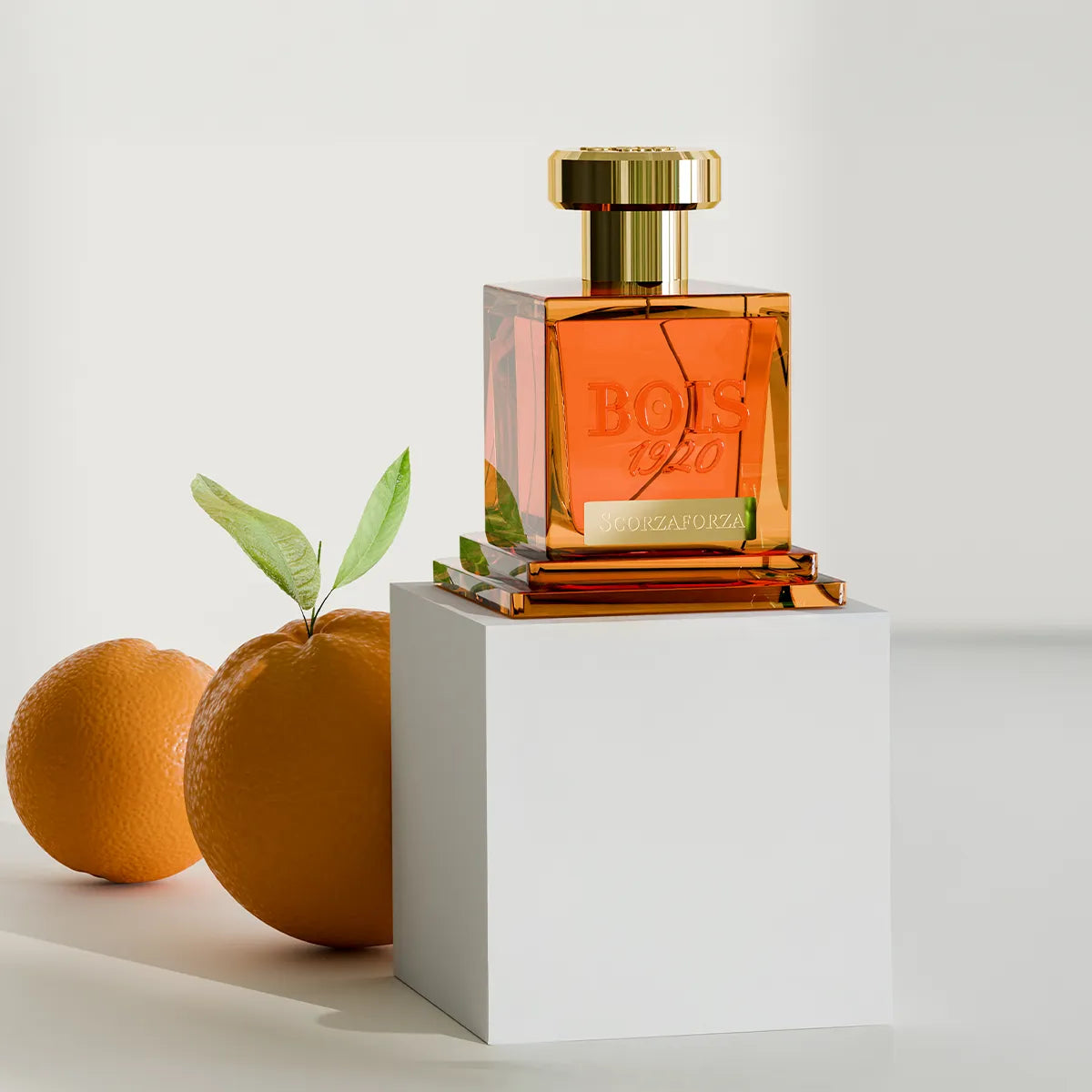 Bois 1920 perfume bottle with oranges on a white background