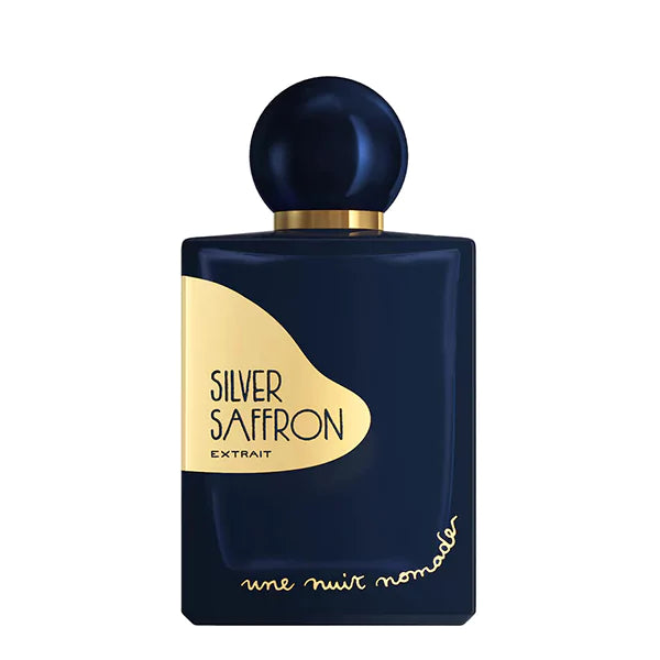 Une Nuit Nomade Silver Saffron Extrait perfume in deep navy bottle with gold label and spherical cap, luxurious niche fragrance inspired by rich saffron, warm spices, and elegant oriental woody notes