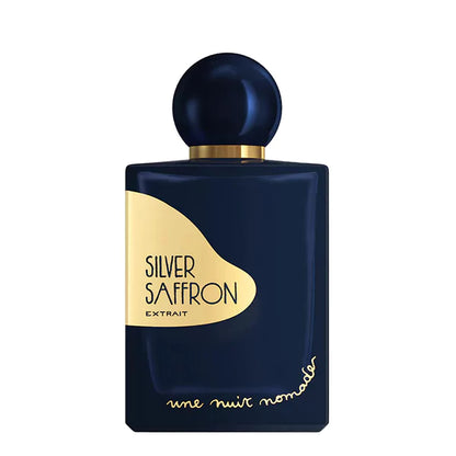 Une Nuit Nomade Silver Saffron Extrait perfume in deep navy bottle with gold label and spherical cap, luxurious niche fragrance inspired by rich saffron, warm spices, and elegant oriental woody notes