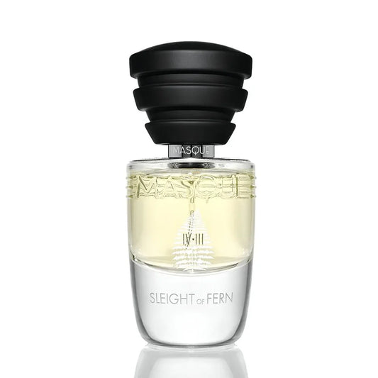 Perfume bottle labeled 'Sleight of Fern' with a black cap on a white background by Masque Milano