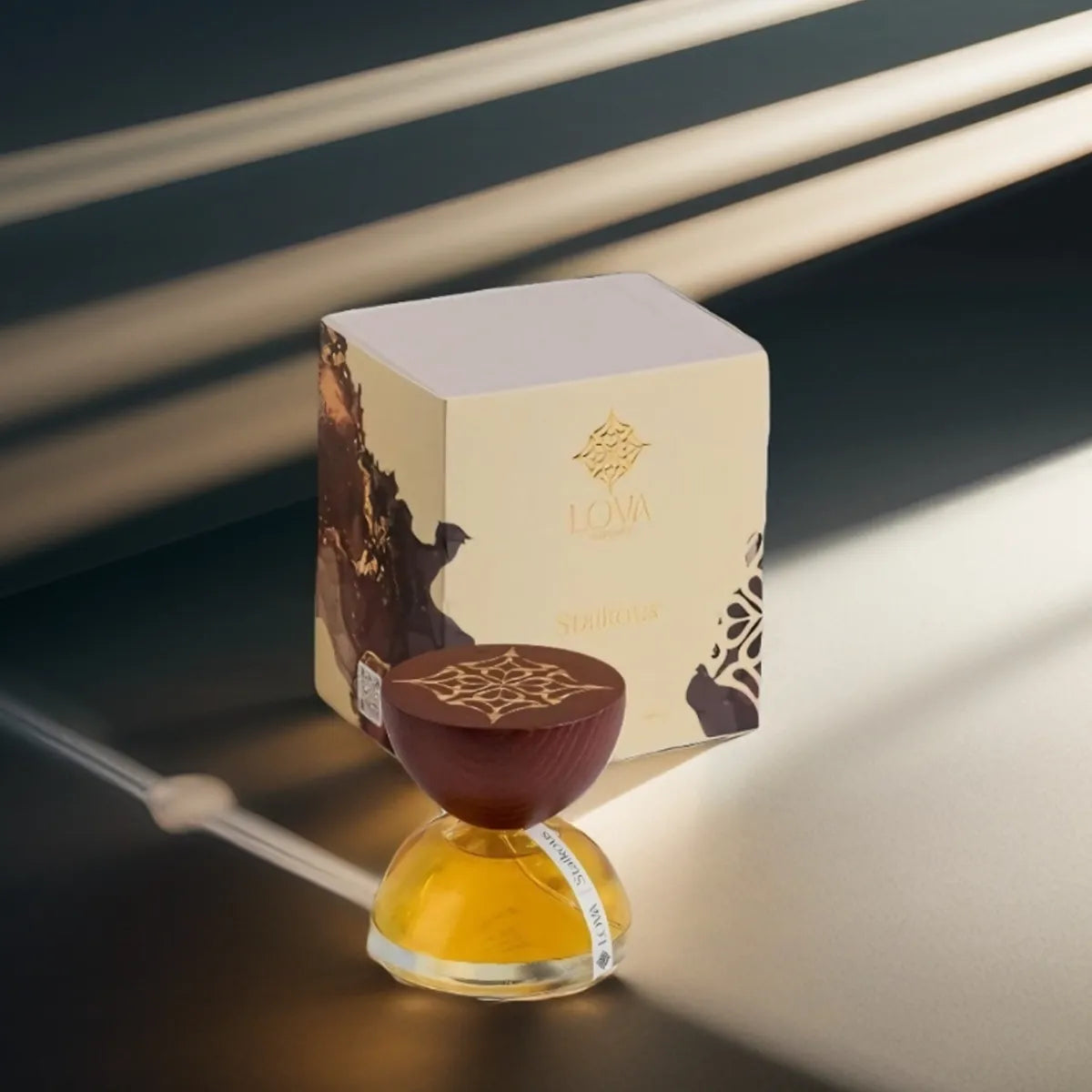 Staikous by LOVA luxury niche perfume with golden glass bottle, handcrafted wooden cap and branded box in elegant outdoor setting