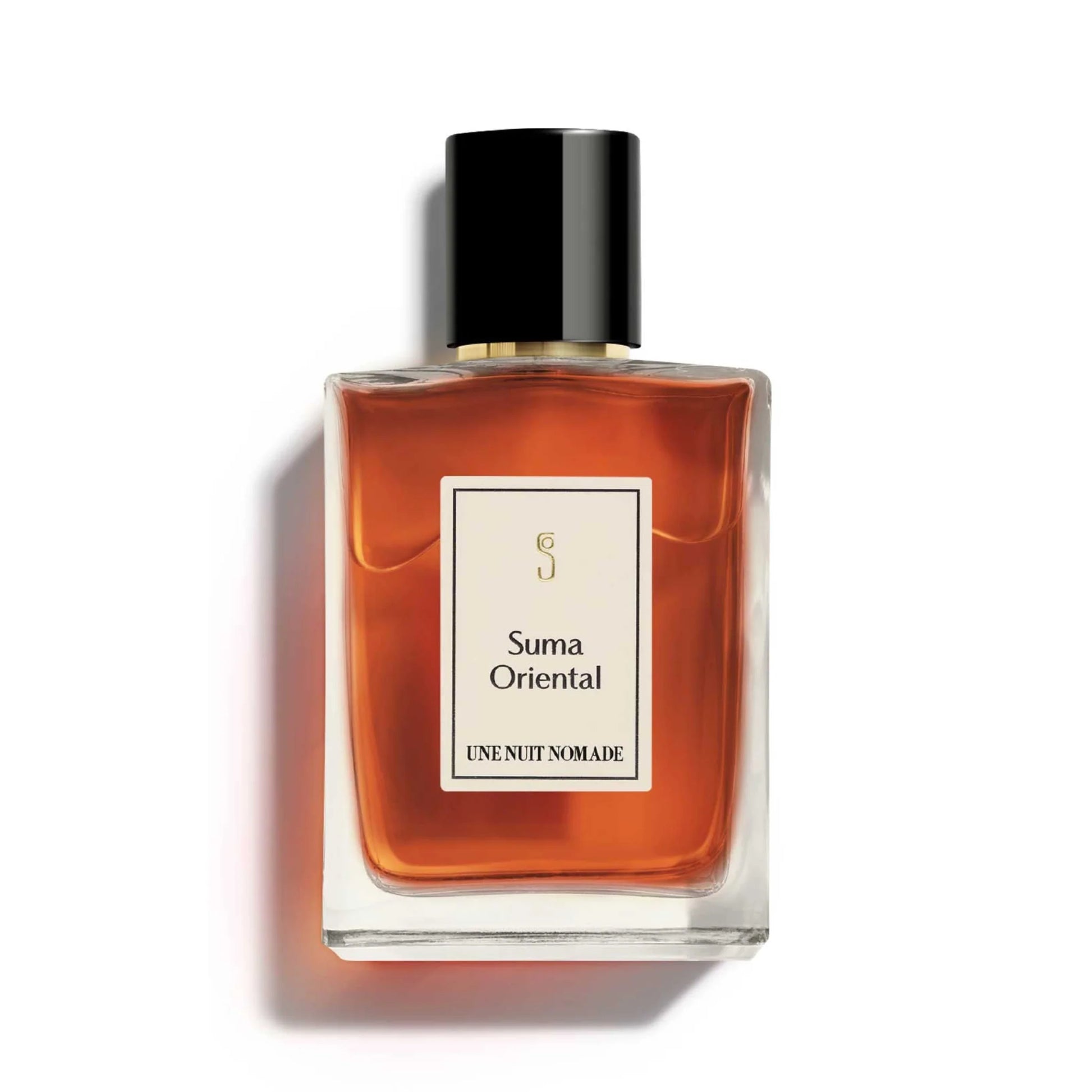 Une Nuit Nomade Suma Oriental Eau de Parfum in elegant glass bottle with rich amber fragrance, luxurious oriental niche perfume with warm spices, resinous woods, and deep sensual notes