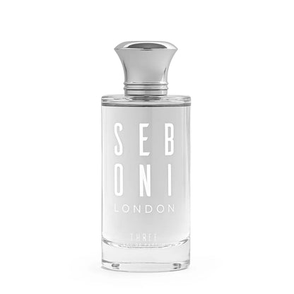 Seboni London Three Eau de Parfum in a clear glass bottle with transparent liquid and a sleek silver cap on a clean white background