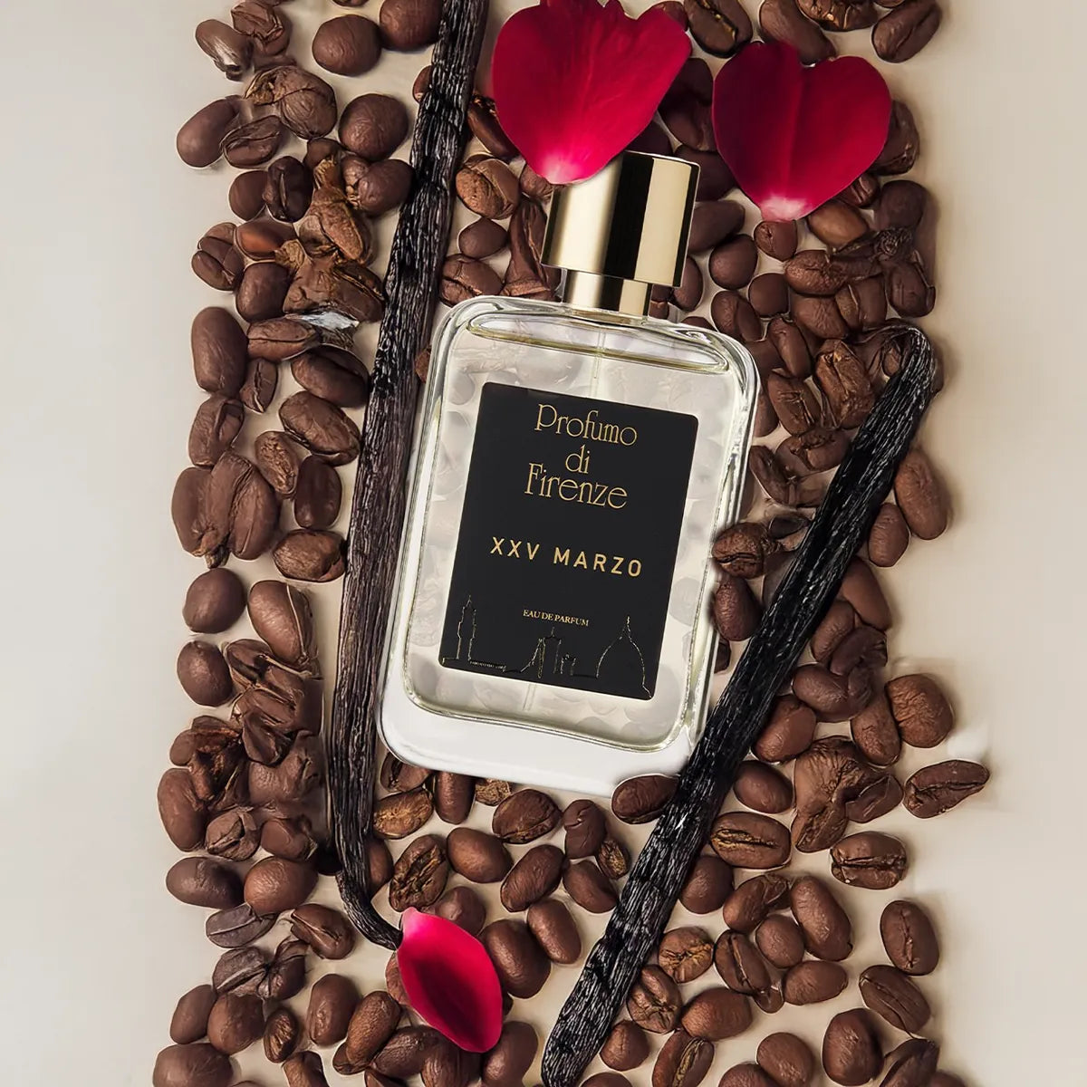 Perfume bottle labeled 'Profumo di Firenze XXV Marzo' surrounded by coffee beans and vanilla pods on a light background